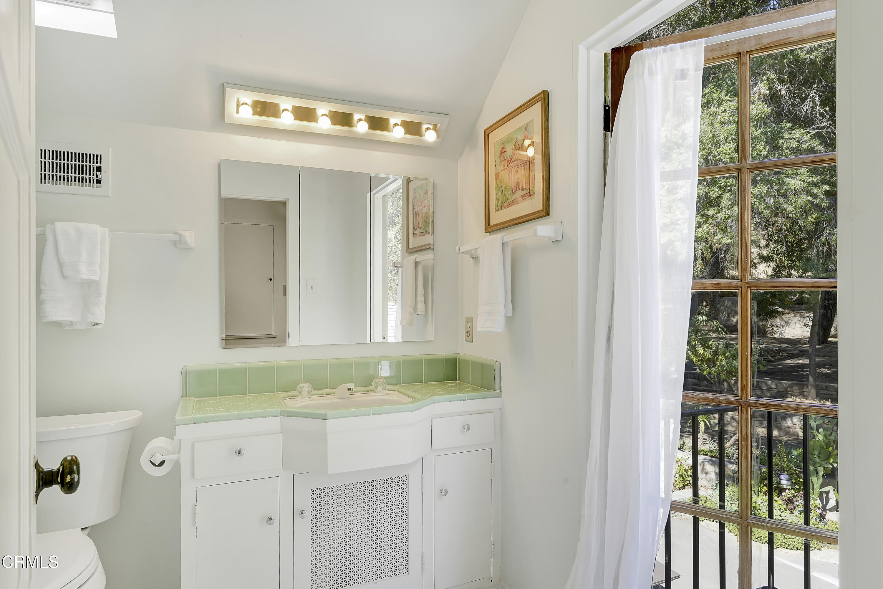 12615 Koenigstein Road Santa Paula, CA 93060 - Photo 25 of 41 a bathroom with a granite countertop sink and a mirror