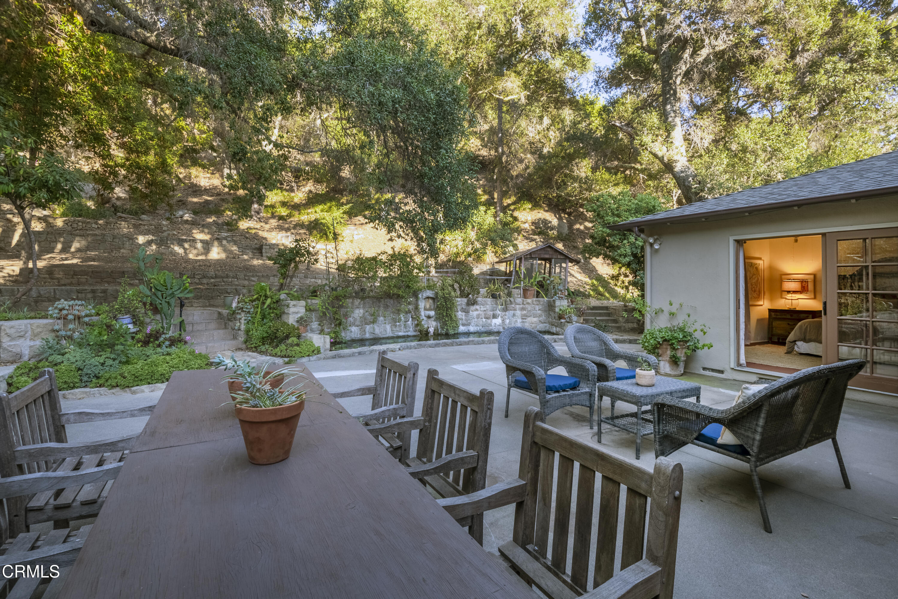 12615 Koenigstein Road Santa Paula, CA 93060 - Photo 29 of 41 a view of a patio with a table and chairs