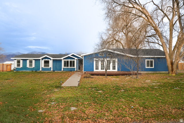 View of front of home featuring a mountain view