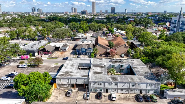 an aerial view of houses with outdoor space
