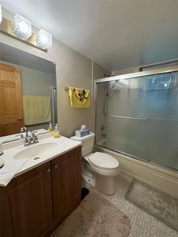 a refrigerator freezer sitting inside of a kitchen