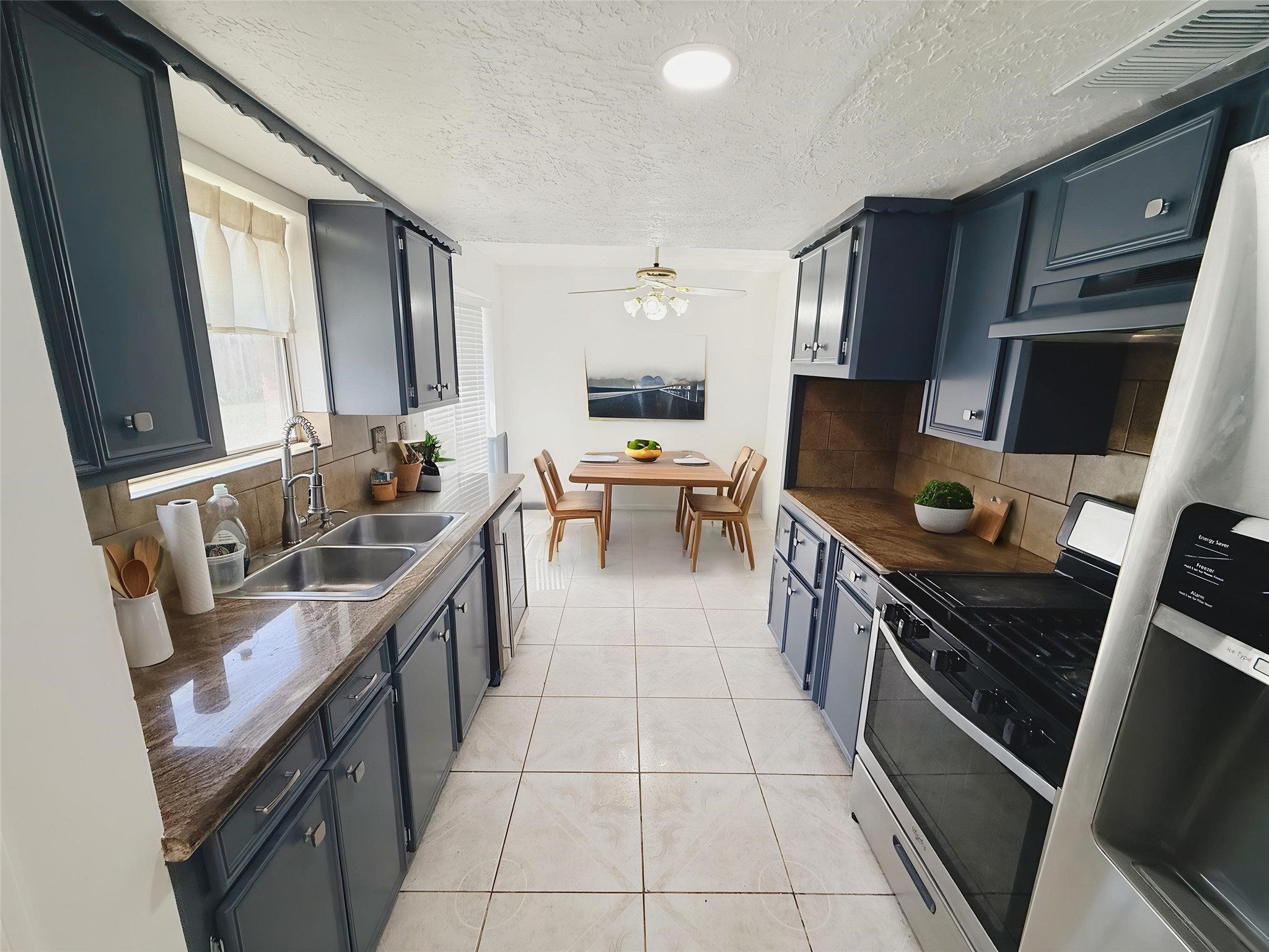 9231 Friendship Road Houston, TX 77080 - Photo 5 of 12 a kitchen with a sink appliances and cabinets