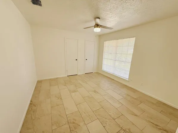 en empty room with windows