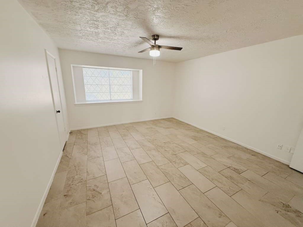 9231 Friendship Road Houston, TX 77080 - Photo 9 of 12 a view of an empty room with a window