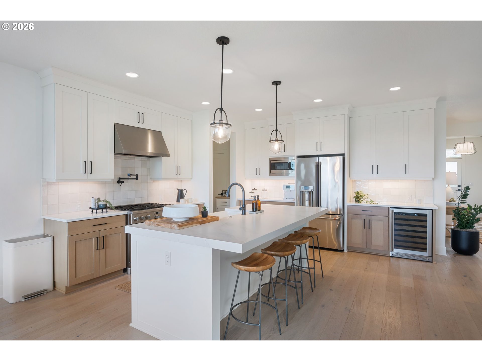 3724 Southwest Hillside Drive Portland, OR 97221 - Photo 12 of 48 a kitchen with stainless steel appliances granite countertop a stove refrigerator sink and cabinets