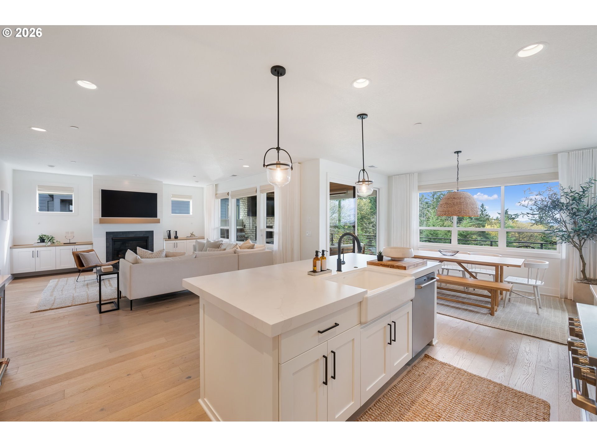 3724 Southwest Hillside Drive Portland, OR 97221 - Photo 14 of 48 a large white kitchen with a large window and island