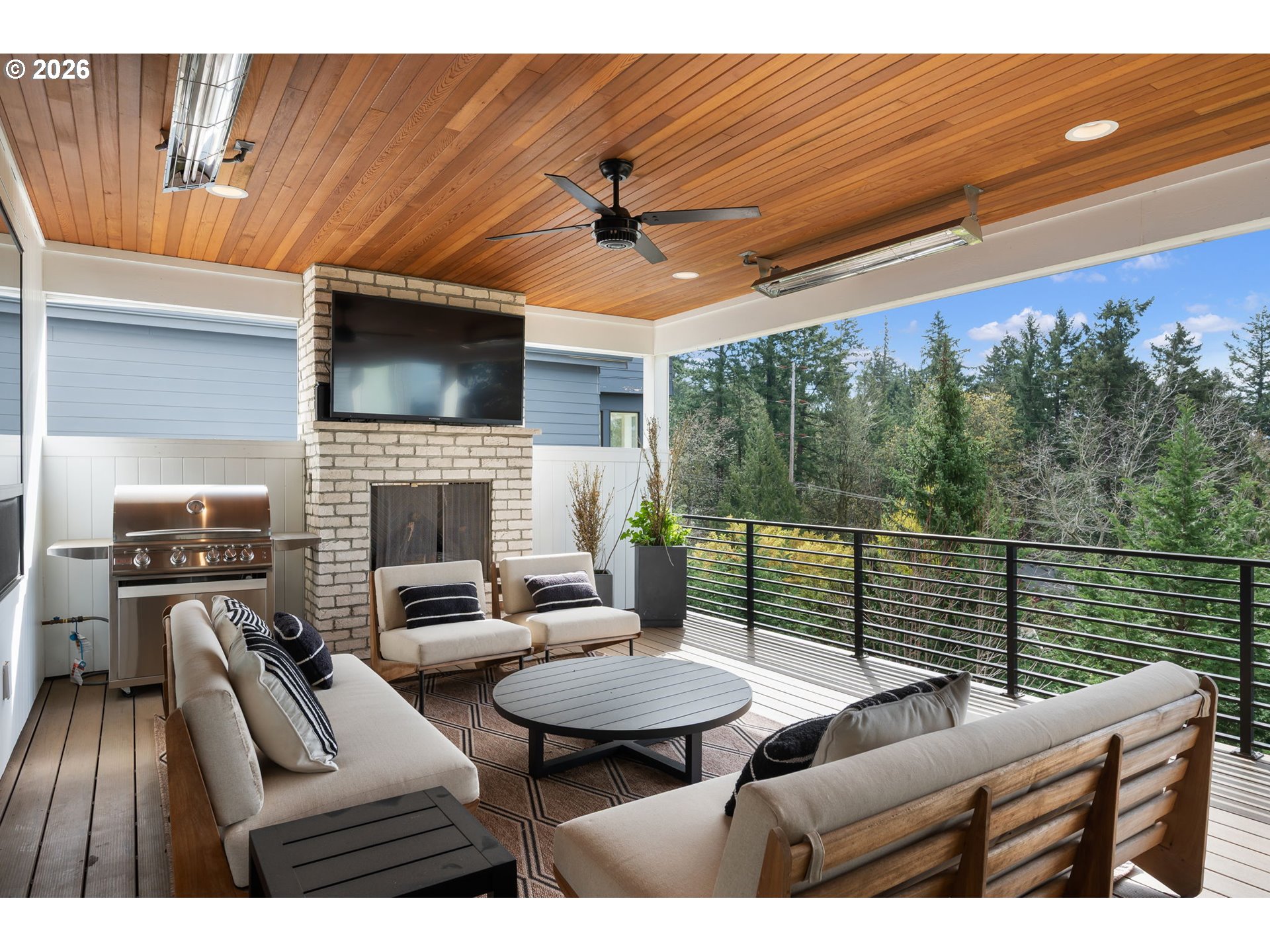 3724 Southwest Hillside Drive Portland, OR 97221 - Photo 17 of 48 a living room with furniture a flat screen tv and a fireplace