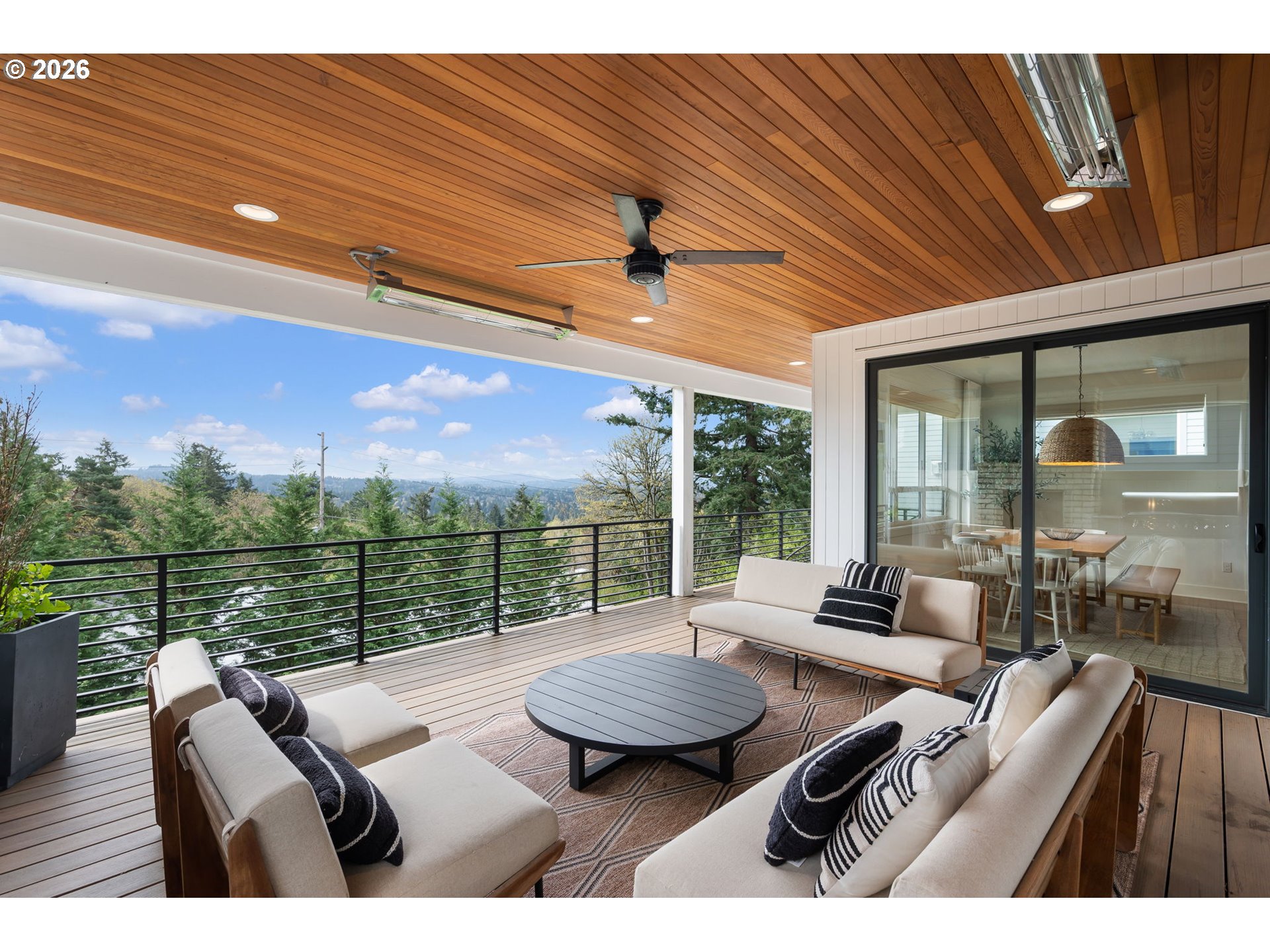 3724 Southwest Hillside Drive Portland, OR 97221 - Photo 18 of 48 a view of balcony with couch and wooden floor