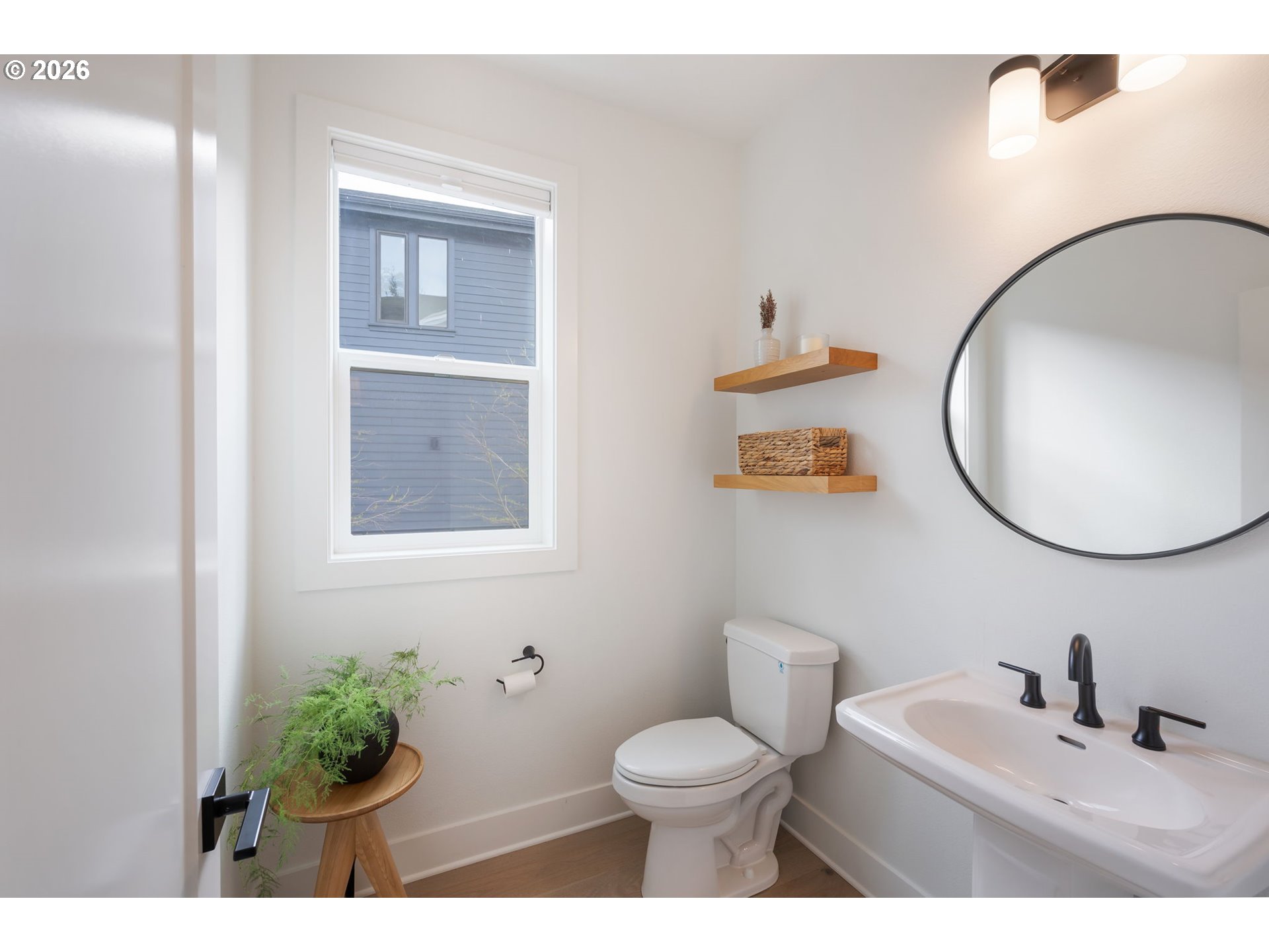 3724 Southwest Hillside Drive Portland, OR 97221 - Photo 20 of 48 a bathroom with a toilet a sink and mirror