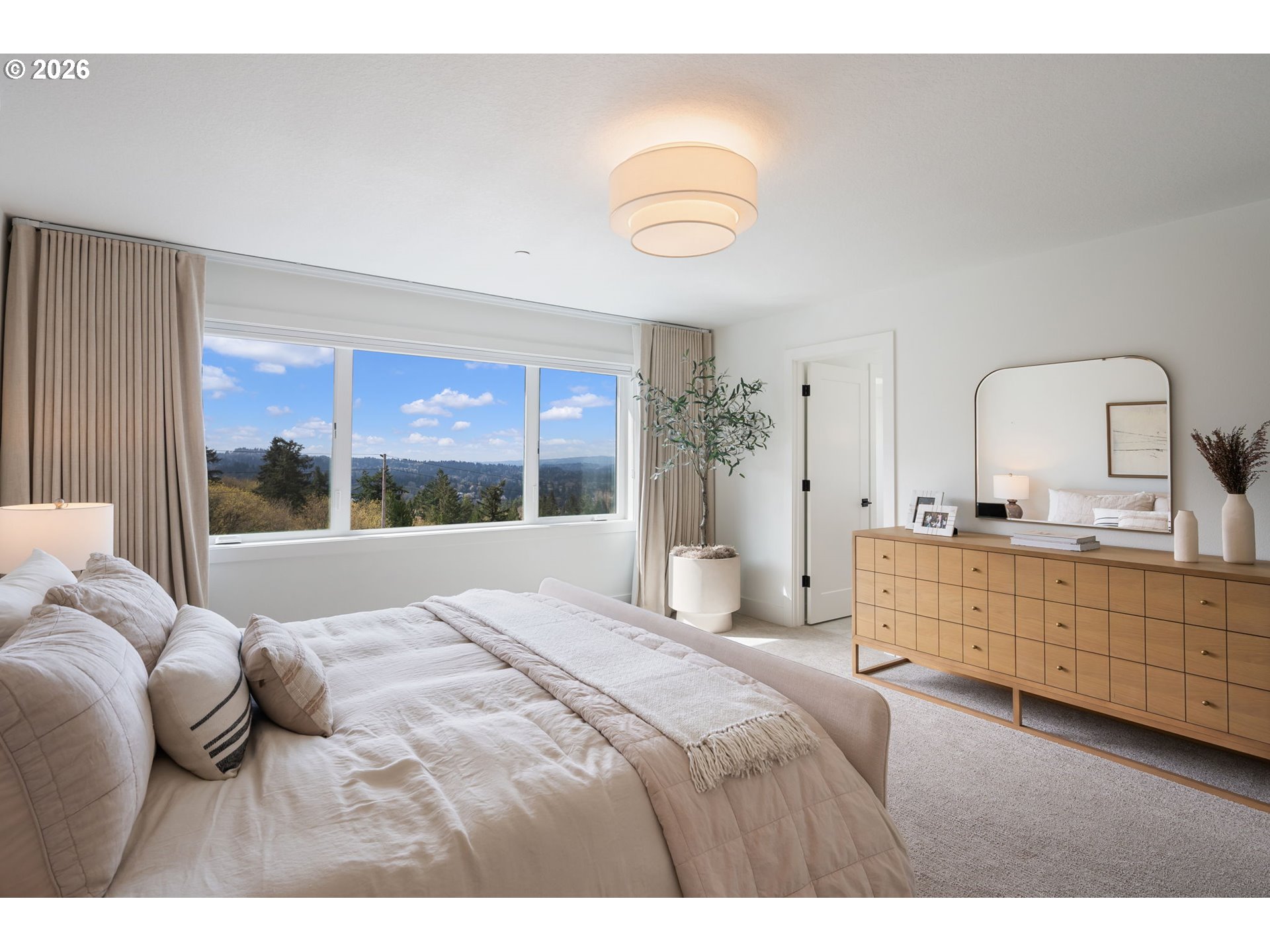 3724 Southwest Hillside Drive Portland, OR 97221 - Photo 22 of 48 a bedroom with a large bed and a window