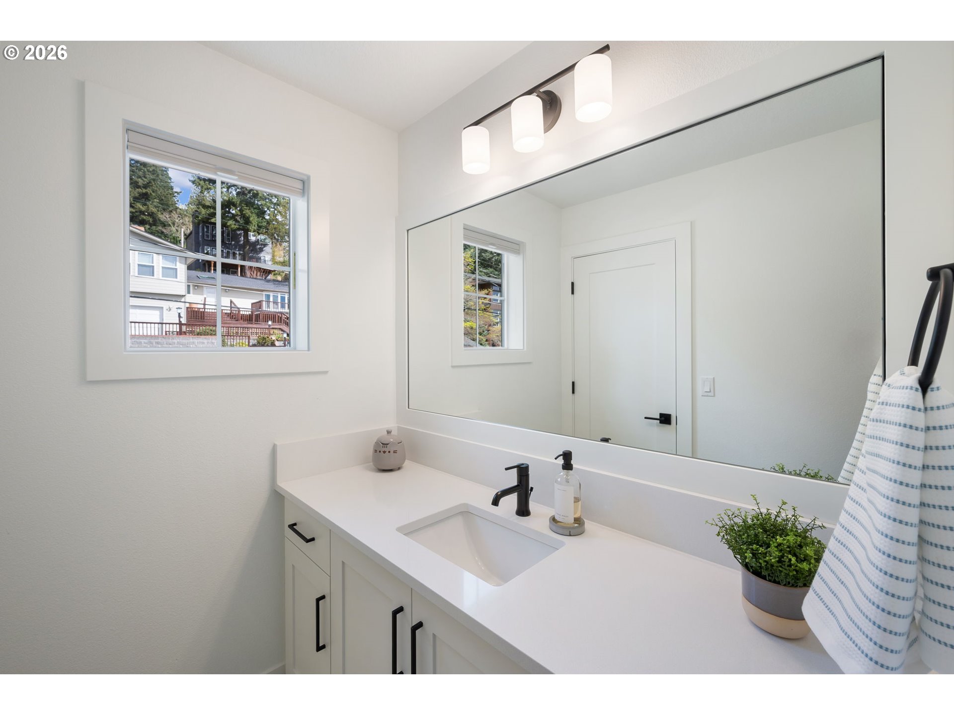 3724 Southwest Hillside Drive Portland, OR 97221 - Photo 29 of 48 a bathroom with a sink and a mirror