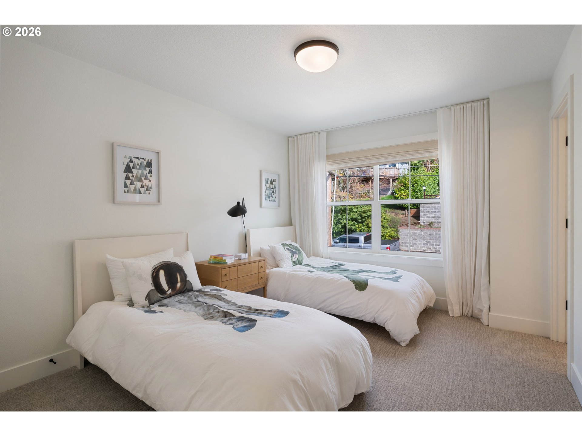 3724 Southwest Hillside Drive Portland, OR 97221 - Photo 30 of 48 a bedroom with a bed and a window