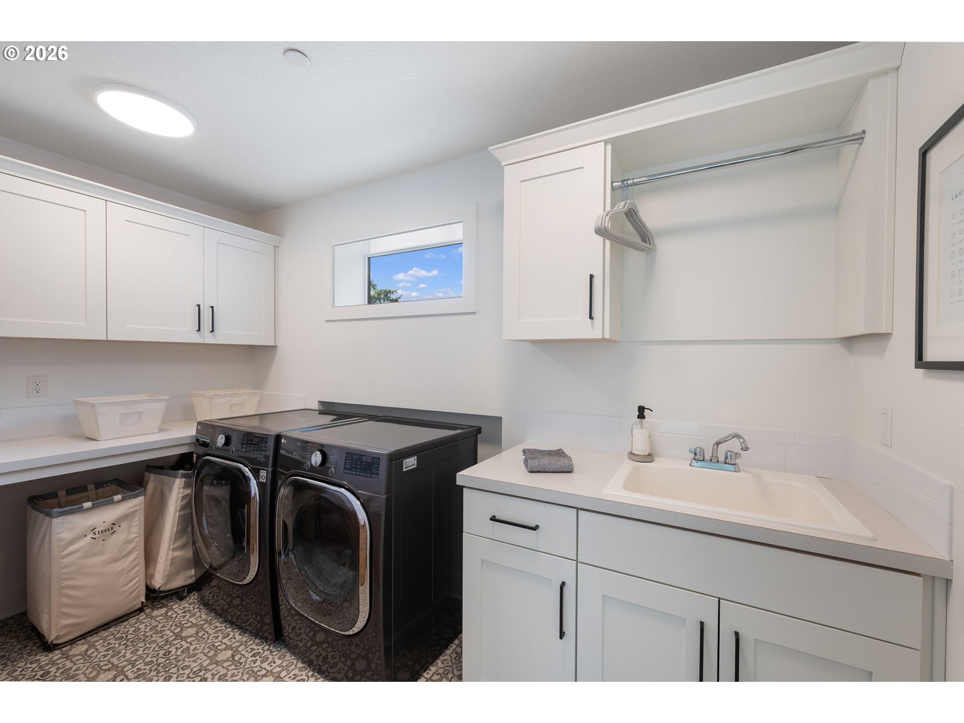 3724 Southwest Hillside Drive Portland, OR 97221 - Photo 31 of 48 a utility room with sink dryer and washer