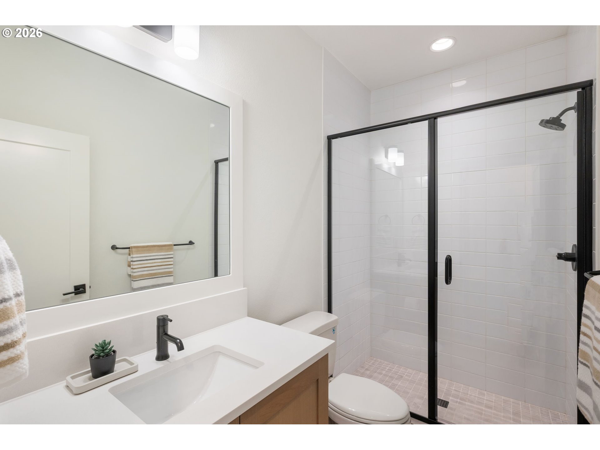 3724 Southwest Hillside Drive Portland, OR 97221 - Photo 36 of 48 a bathroom with a sink mirror and shower