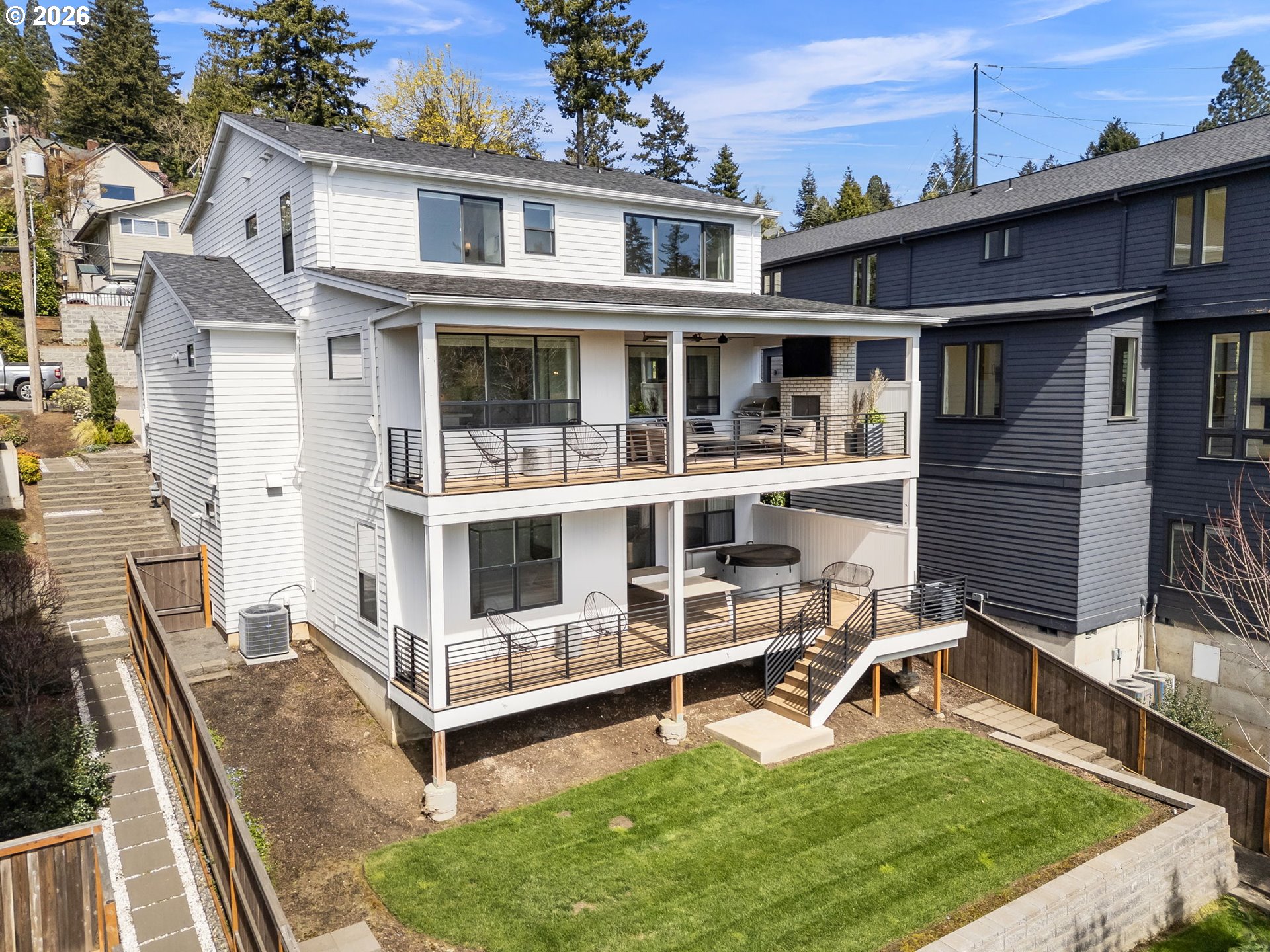 3724 Southwest Hillside Drive Portland, OR 97221 - Photo 41 of 48 a view of a house with wooden deck and furniture