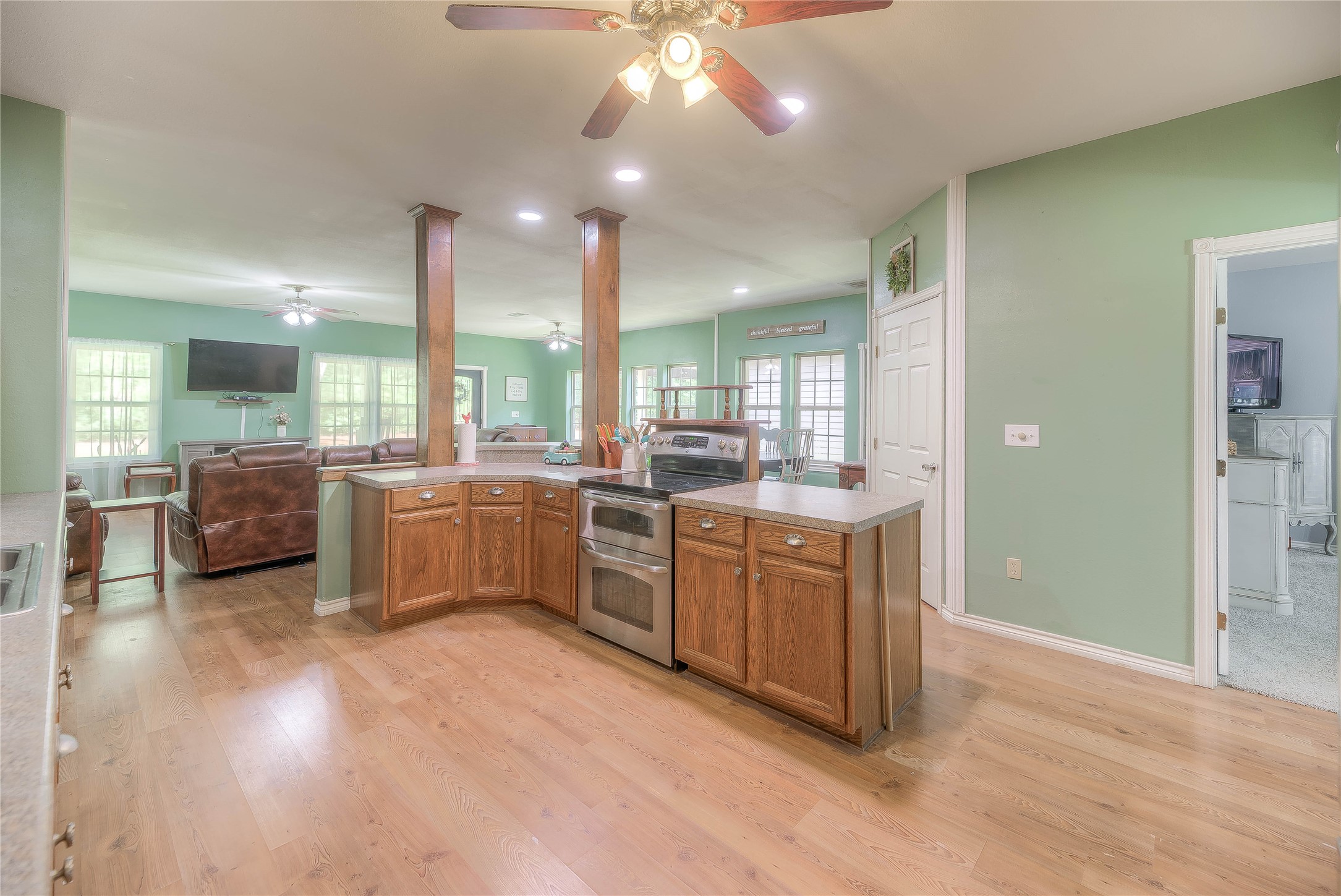 110 Happy Trails Road Coldspring, TX 77331 - Photo 10 of 49 a kitchen with a sink cabinets and wooden floor