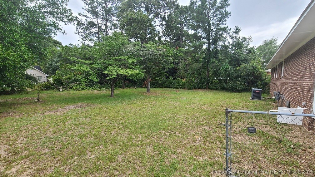 5326 Hampton Road Fayetteville, NC 28311 - Photo 16 of 17 a view of outdoor space with deck and yard