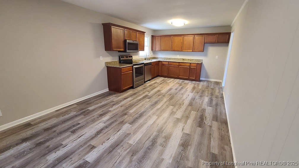 5326 Hampton Road Fayetteville, NC 28311 - Photo 5 of 17 a kitchen with granite countertop a sink cabinets and stainless steel appliances