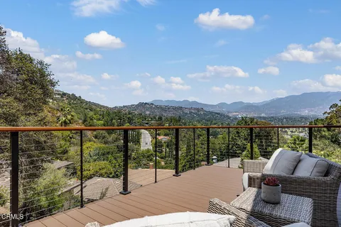 a view of a balcony with lake view and mountain view