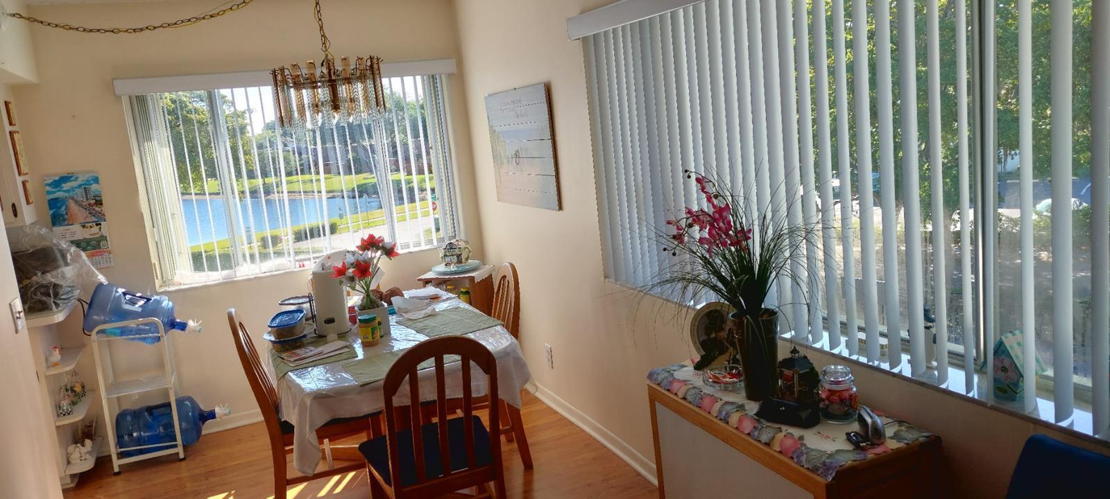 3100 Springdale Boulevard, Unit 317 Palm Springs, FL 33461 - Photo 18 of 18 a view of a dining room with furniture window and outside view
