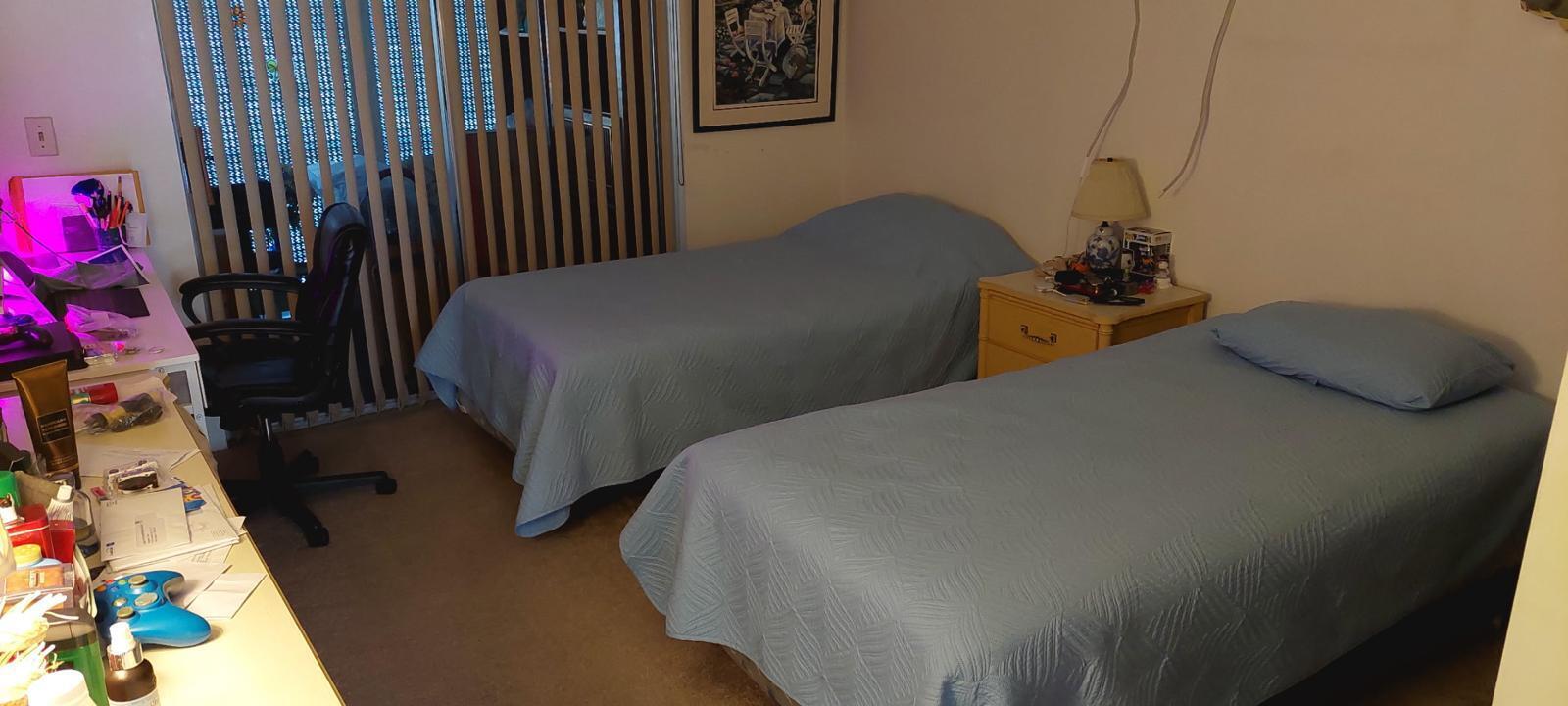 3100 Springdale Boulevard, Unit 317 Palm Springs, FL 33461 - Photo 8 of 18 a bedroom with a bed and a potted plant