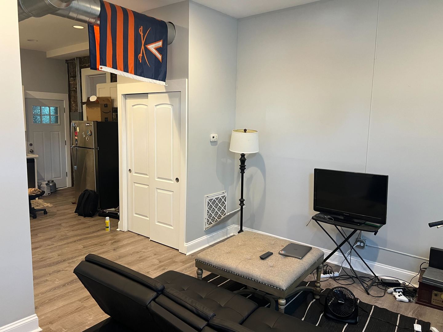 1716 West 19th Street, Unit 2S Chicago, IL 60608 - Photo 3 of 5 a view of a workspace with furniture and a flat screen tv