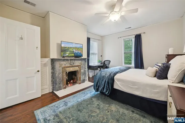a bedroom with a bed and a fireplace