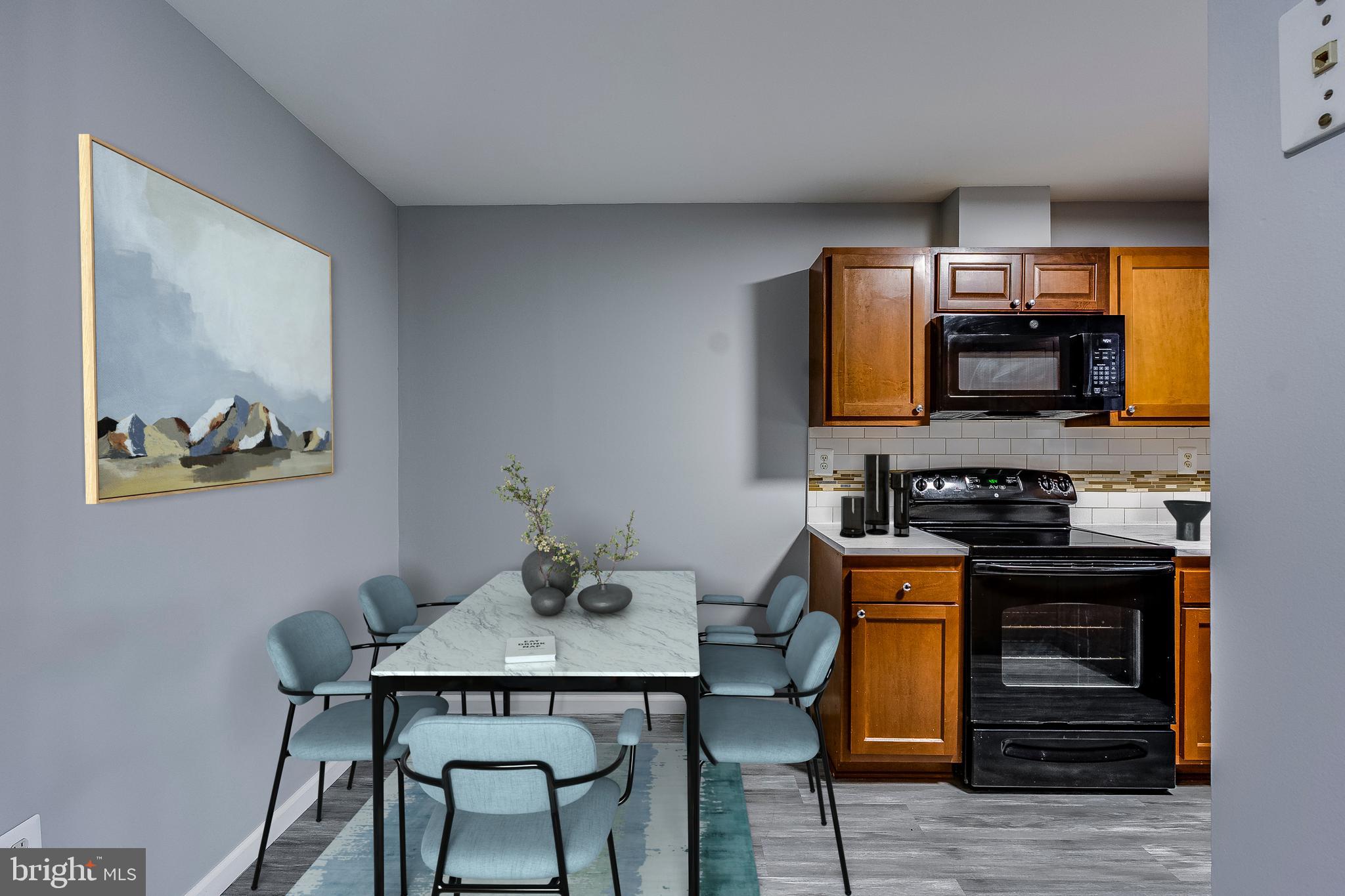 7410 Crane Place Landover, MD 20785 - Photo 13 of 23 a kitchen with a stove and a refrigerator