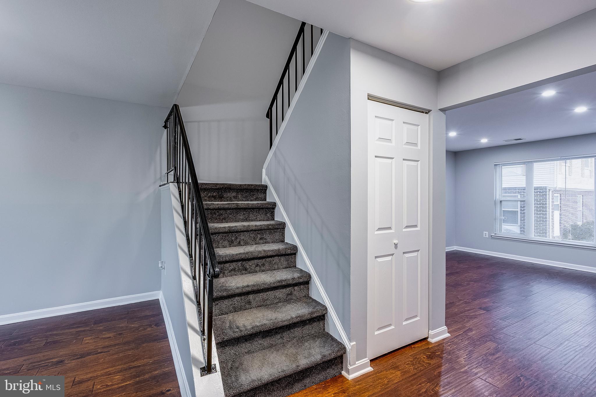 7410 Crane Place Landover, MD 20785 - Photo 14 of 23 a view of entryway with wooden floor and stairs