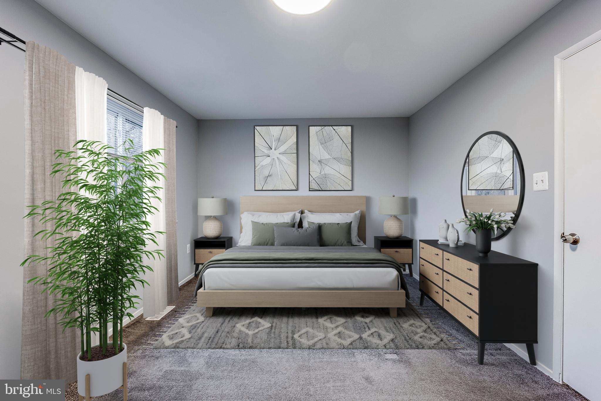 7410 Crane Place Landover, MD 20785 - Photo 16 of 23 a spacious bedroom with a bed and a potted plant