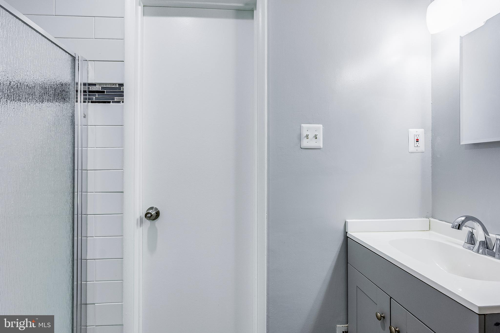 7410 Crane Place Landover, MD 20785 - Photo 19 of 23 a bathroom with a sink and mirror