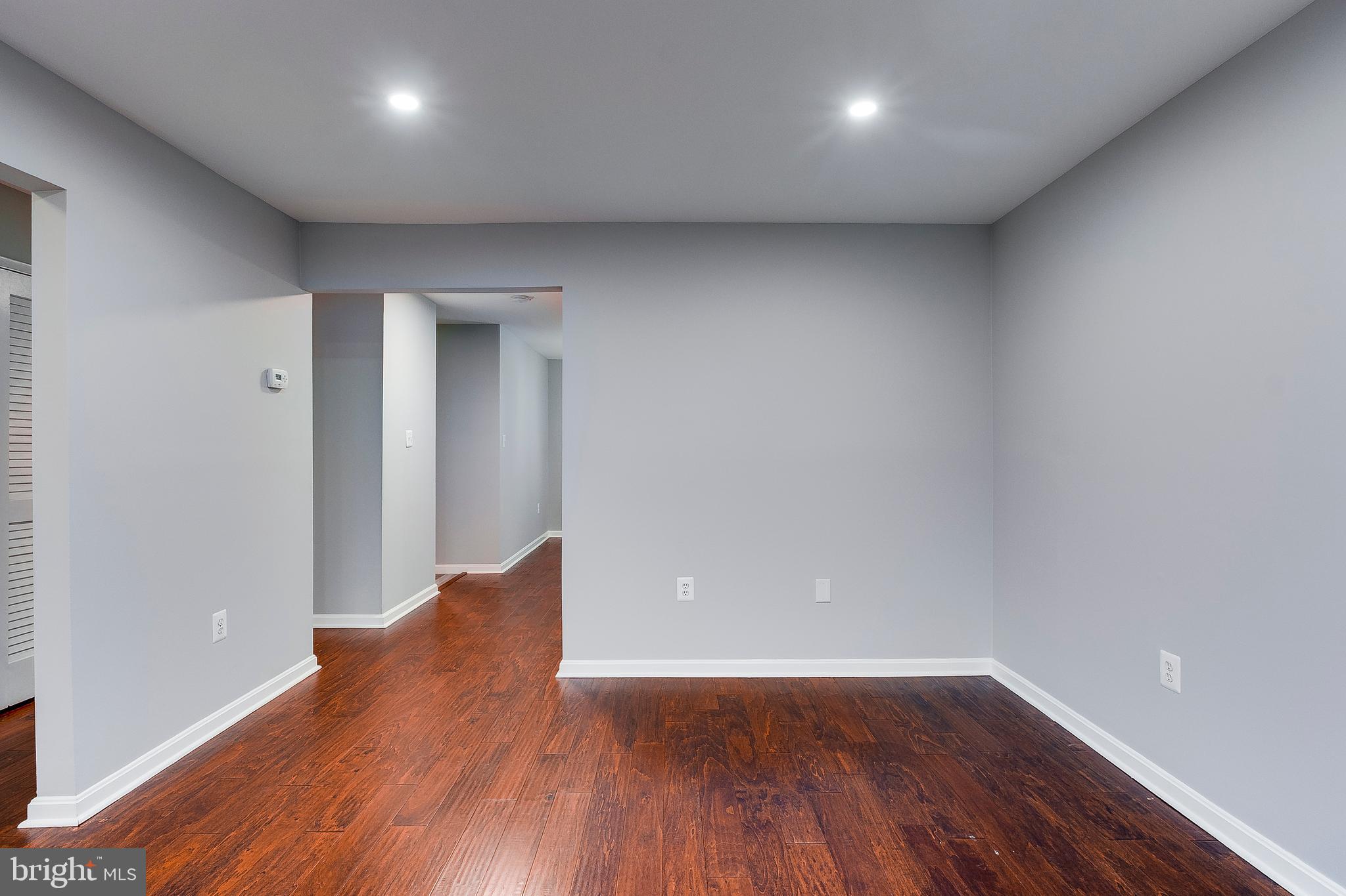 7410 Crane Place Landover, MD 20785 - Photo 8 of 23 wooden floor in a hall with an empty room