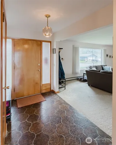a view of a livingroom with furniture and windows