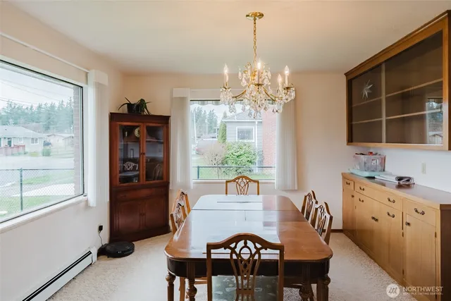 a view of a dining room with furniture window and outside view