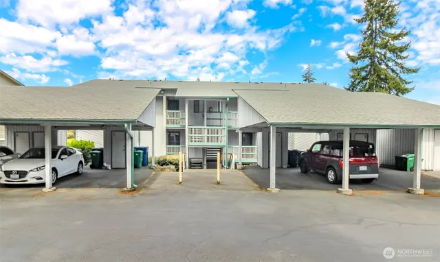 a view of a house with a yard and garage