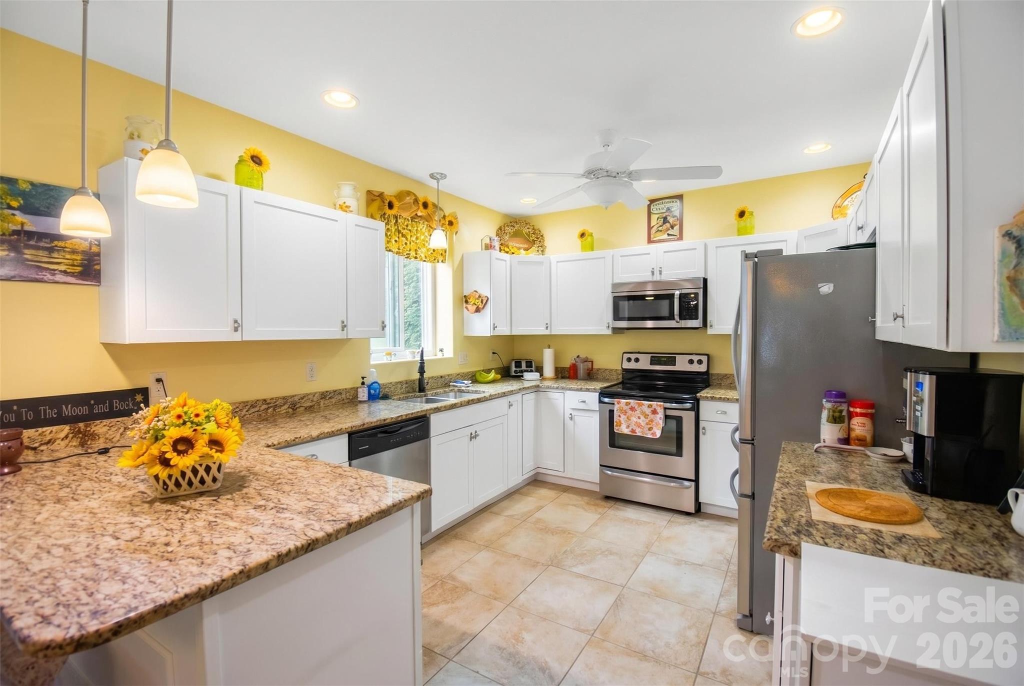 945 North Country Club Road Brevard, NC 28712 - Photo 7 of 42 a kitchen with stainless steel appliances granite countertop a sink counter space and cabinets