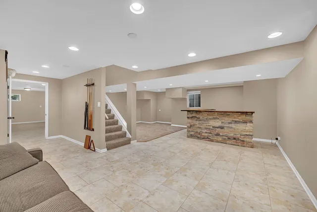 a view of an empty room with stairs