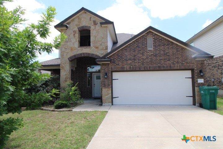 1202 Stonewall Ridge Harker Heights, TX 76548 - Photo 1 of 14 a front view of a house with garden