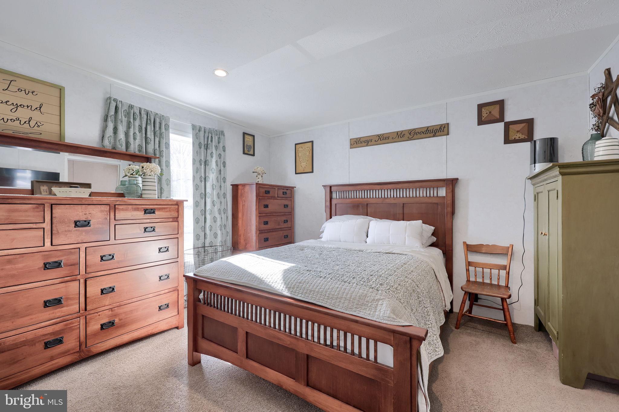 1395 Bowmansville Road Mohnton, PA 19540 - Photo 21 of 26 a bed room with a bed and a dresser