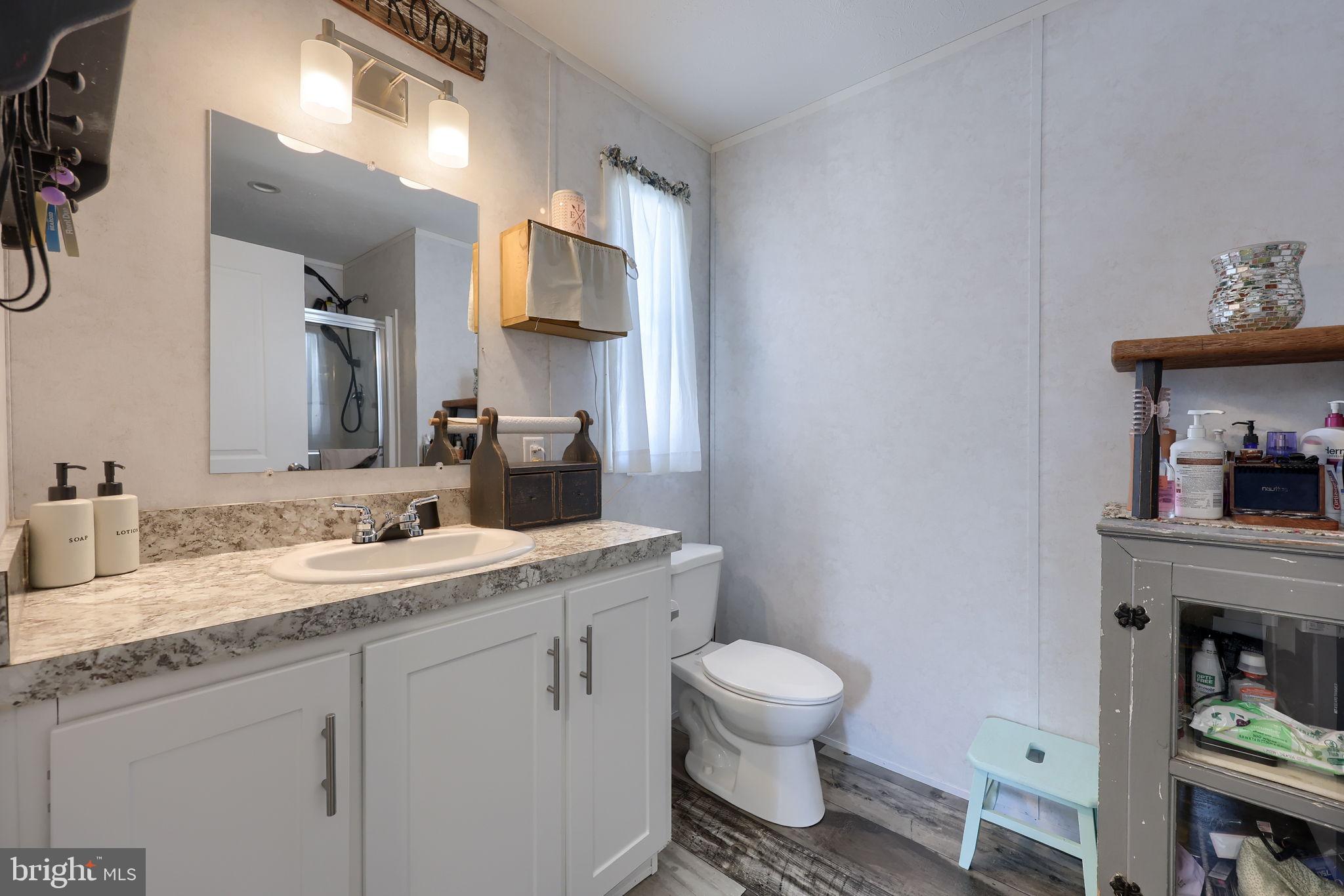 1395 Bowmansville Road Mohnton, PA 19540 - Photo 23 of 26 a bathroom with a toilet sink and mirror