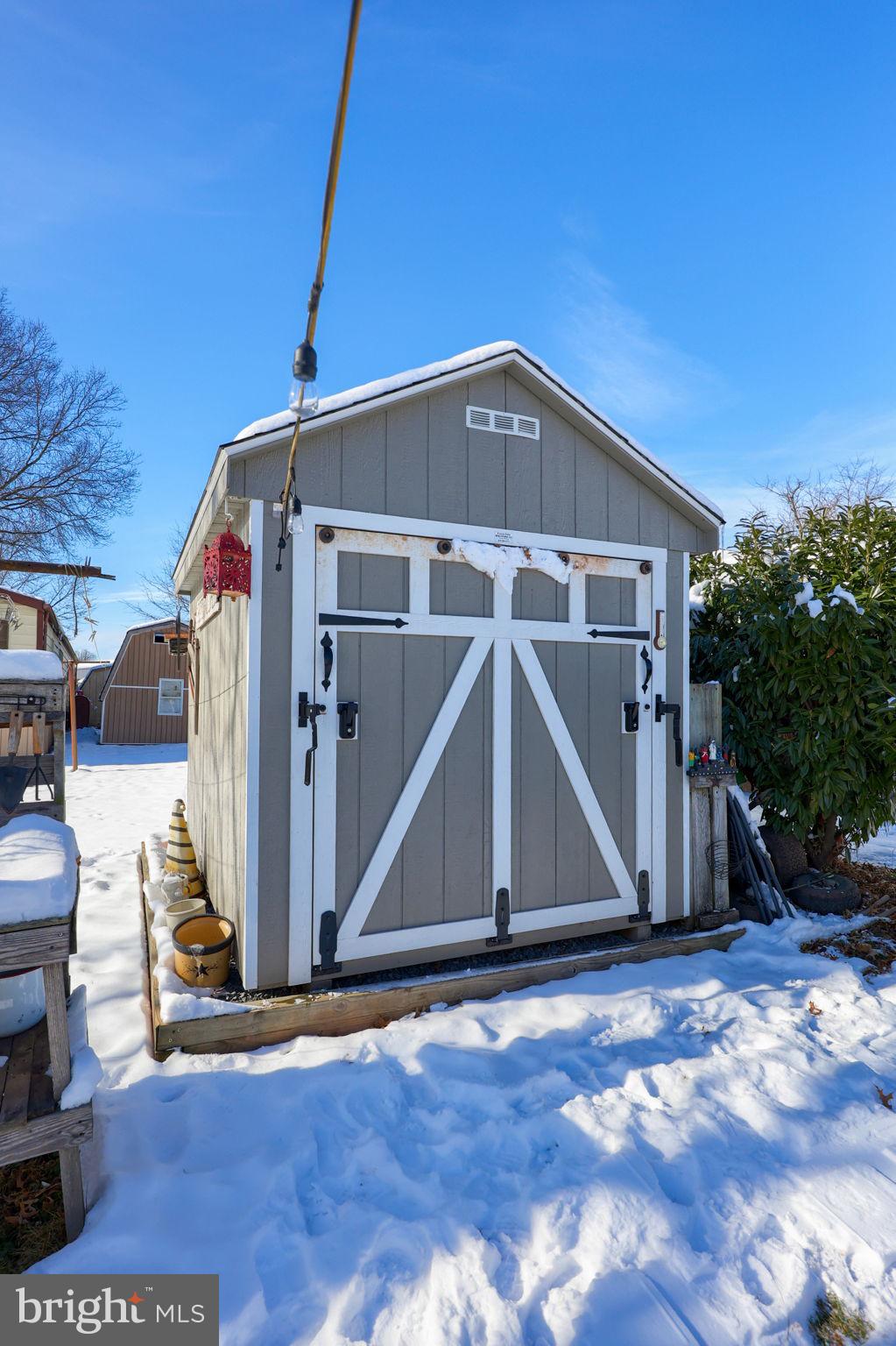 1395 Bowmansville Road Mohnton, PA 19540 - Photo 7 of 26 a front view of a house with wooden stairs