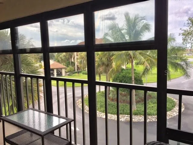a view of a bench in wooden floor