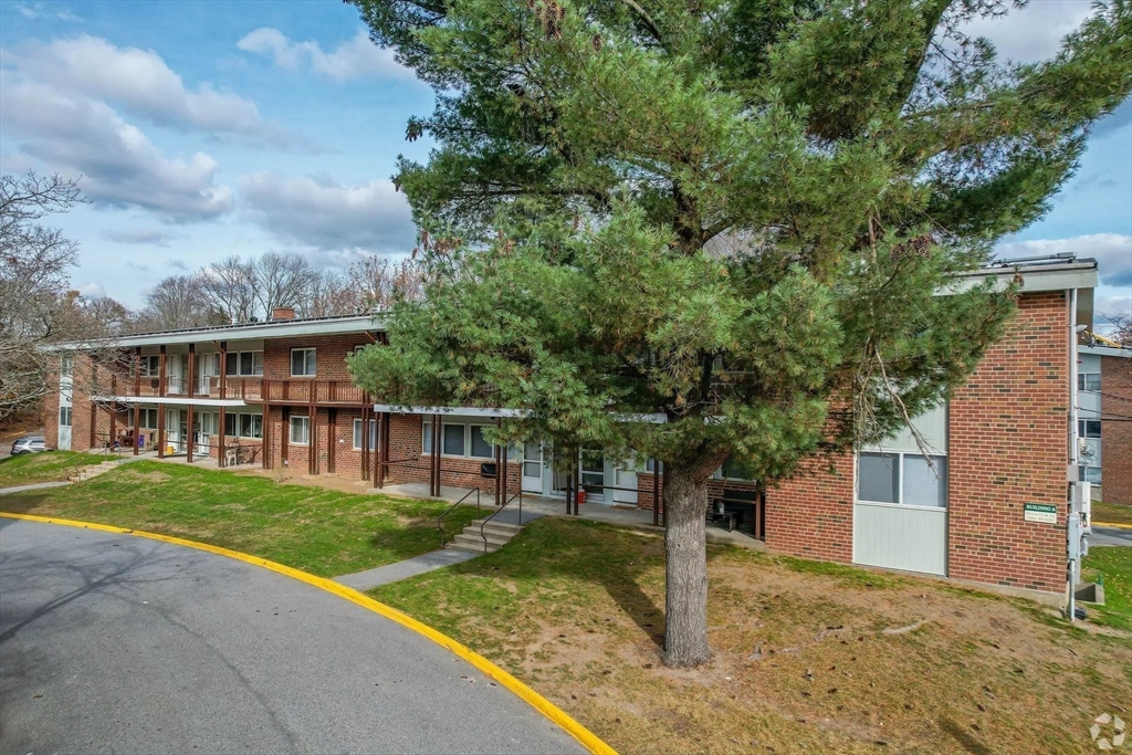 8 Lakeview Gardens, Unit 6 Natick, MA 01760 - Photo 11 of 13 a view of a house with a yard