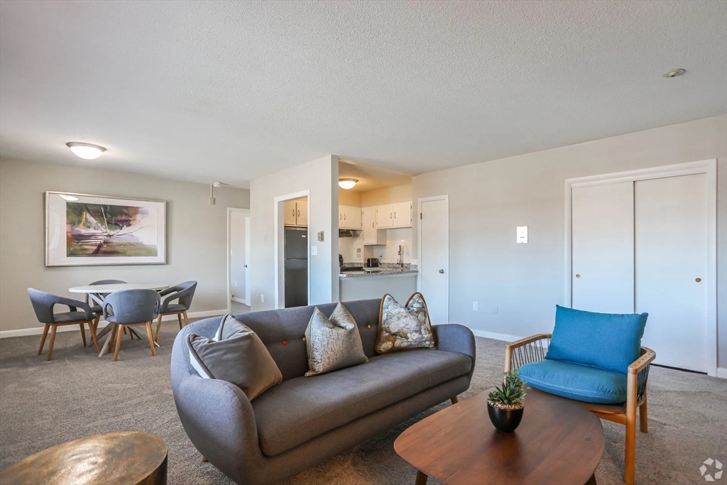 8 Lakeview Gardens, Unit 6 Natick, MA 01760 - Photo 2 of 13 a view of a livingroom with furniture and a wooden floor