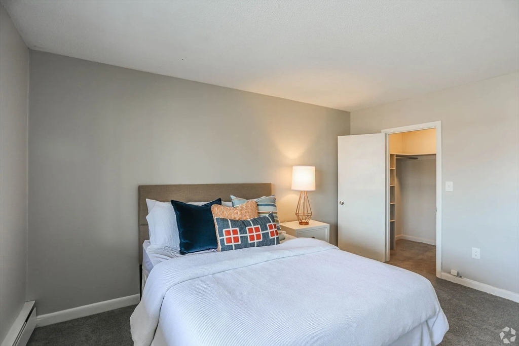 8 Lakeview Gardens, Unit 6 Natick, MA 01760 - Photo 7 of 13 a bedroom with a bed and window