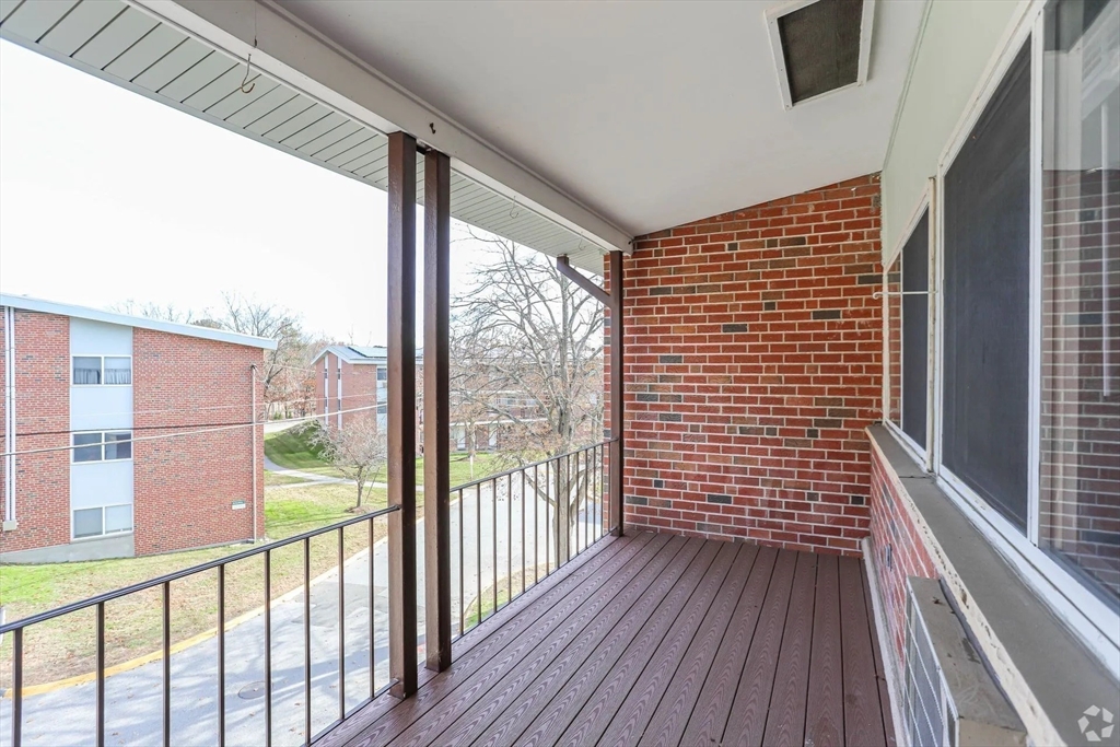 8 Lakeview Gardens, Unit 6 Natick, MA 01760 - Photo 10 of 13 a view of a balcony with wooden floor