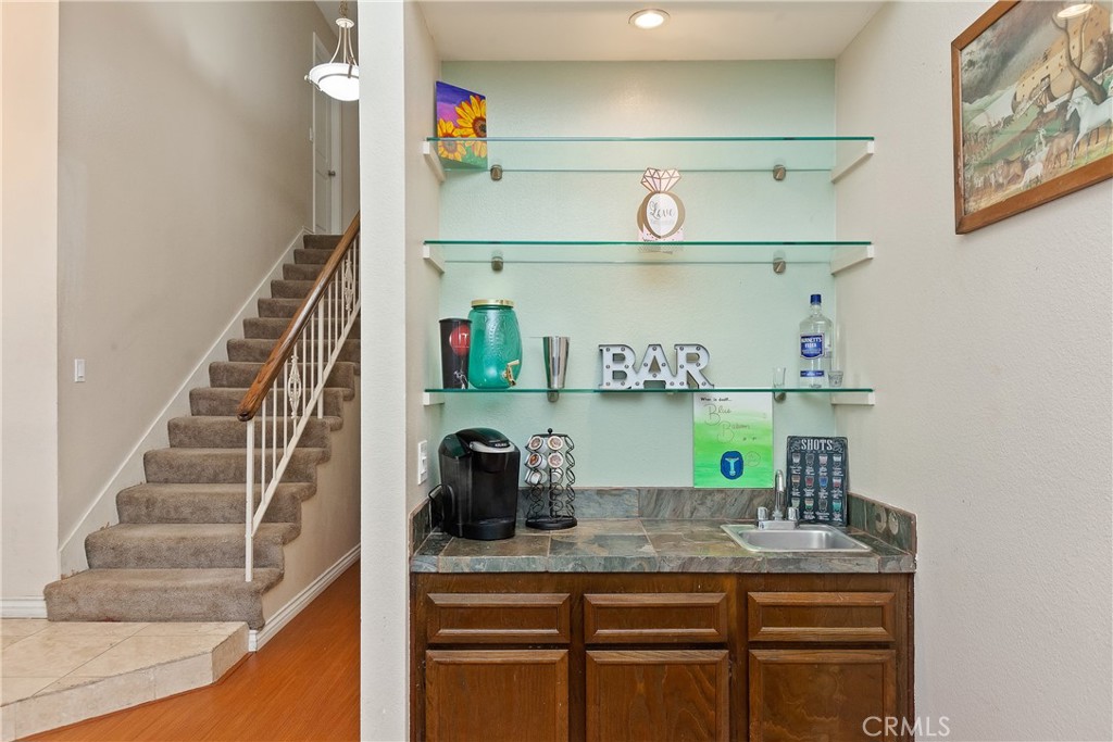 1834 West Las Palmas Circle Orange, CA 92868 - Photo 9 of 25 a kitchen with cabinets and wooden floor