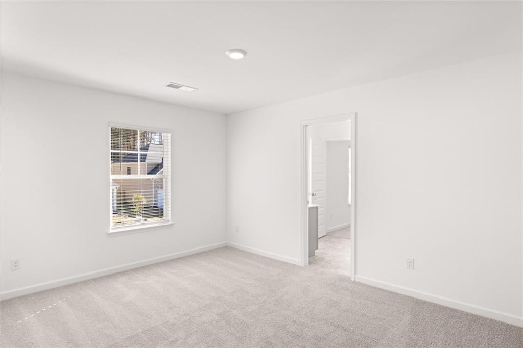 1787 Goodwin Drive Hampton, GA 30228 - Photo 15 of 55 a view of an empty room with a window