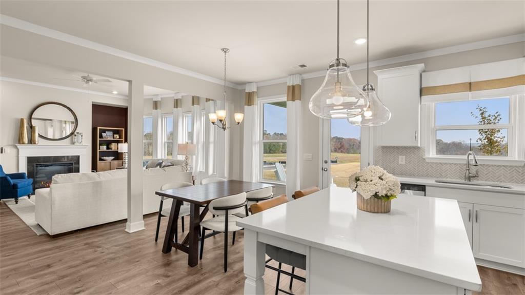 1787 Goodwin Drive Hampton, GA 30228 - Photo 21 of 55 a view of a dining room with furniture and a chandelier