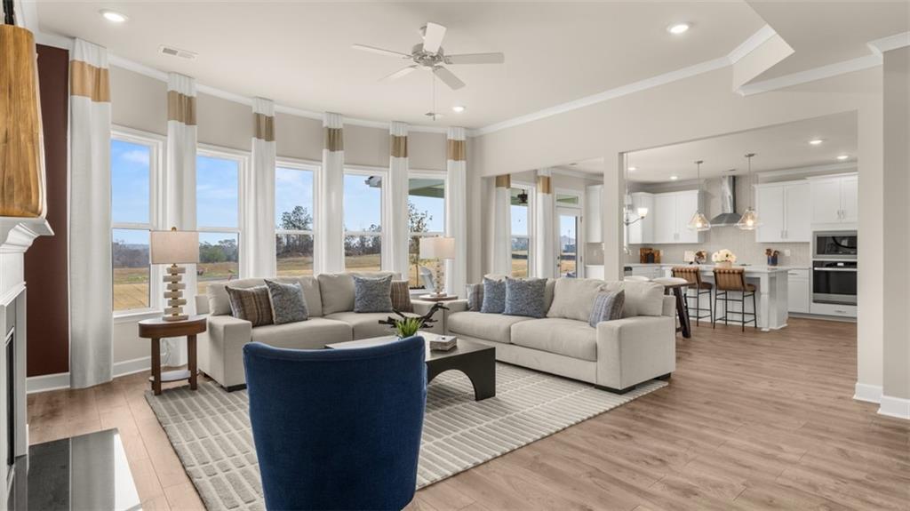 1787 Goodwin Drive Hampton, GA 30228 - Photo 25 of 55 a living room with furniture and a large window